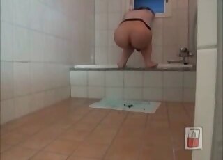 Solo action in the bathroom with a big booty cougar