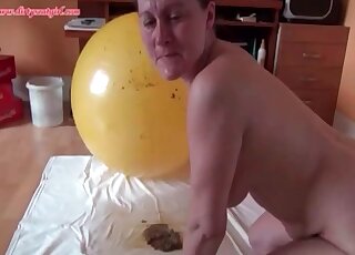 Mature woman playing with a messy yoga ball